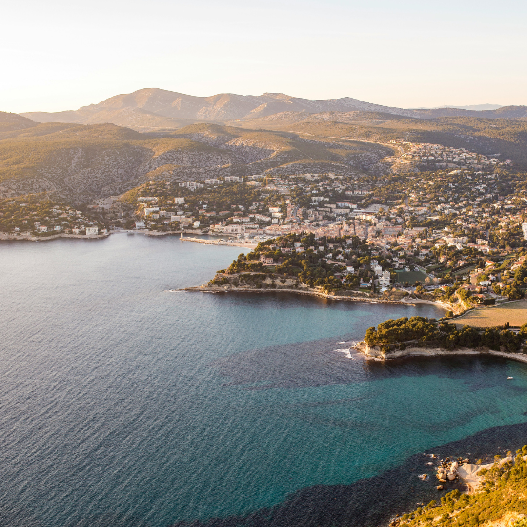 An aerial view of a city next to a lake.